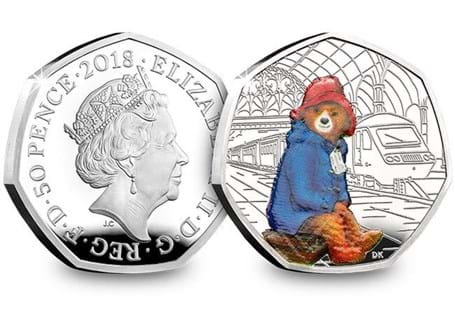 UK 2018 Silver Proof Paddington Bear at Paddington Station, issued to celebrate the 60th anniversary of Paddington Bear. The reverse design features Paddington wearing his famous duffle coat. 