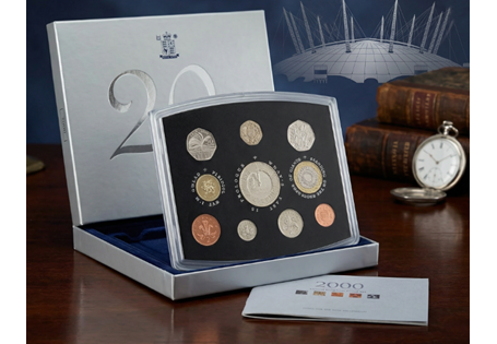 The 2000 Proof set contains the following: Millennium £5, the Welsh £1, £2, 50p (Libraries) 20p, 10p, 5p, 2p and 1p. This set comes presented in a deluxe royal mint silver stand case.